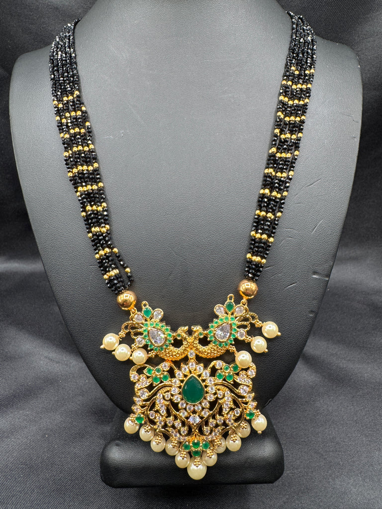 CZ stones and Emerald stones pendant with a bunch of black diamond beads necklace