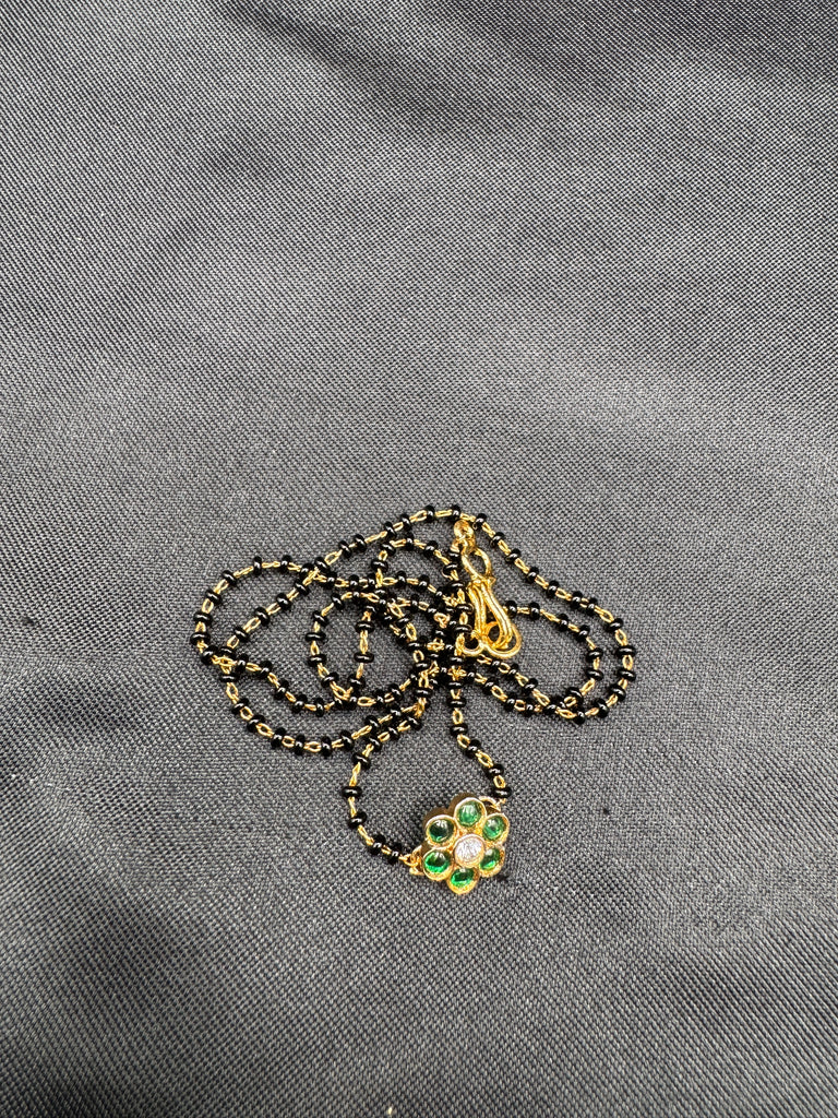 Cute Emerald pendant with a single line of black bead chain