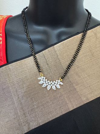 Leaf design cz stones pendant with a double line black beads chain