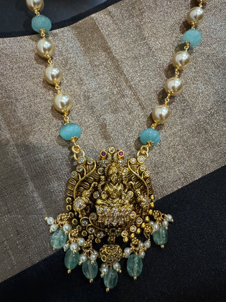 Antique Lakshmi pendant with pumpkin beads and a pearl chain