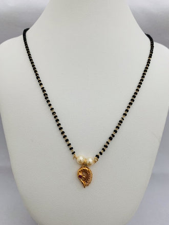 Antique finish Peacock design pendant with a single line black beads chain - Globus Fashions