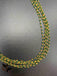 Bunch of green crystal beads twisted with gold chains