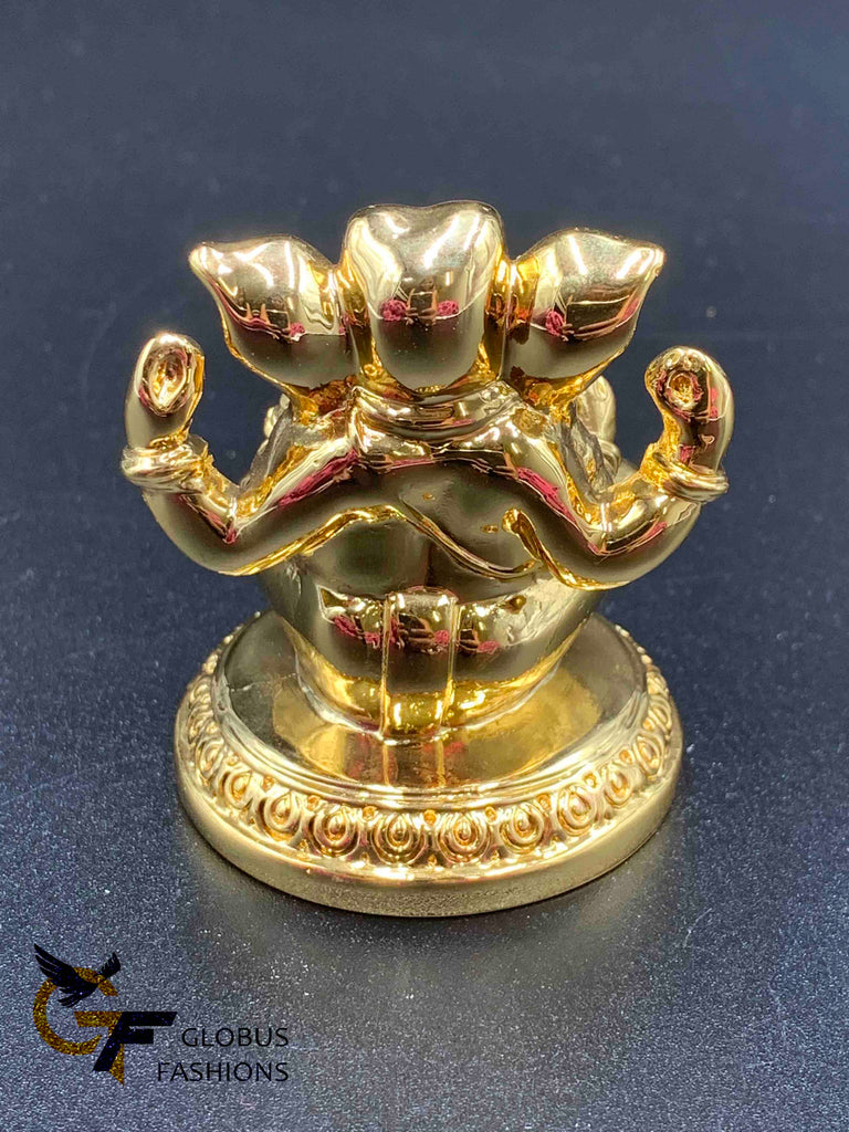 Cute gold ganesh idol