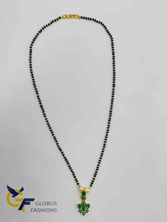Emerald stones pendant with a single line black beads chain