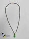 Emerald stones pendant with a single line black beads chain