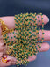 Bunch of green crystal beads twisted with gold chains