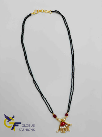 Traditional kundan and ruby stones with pearls pendant with black diamond beads chain
