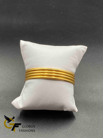 Set of four plain gold bangles