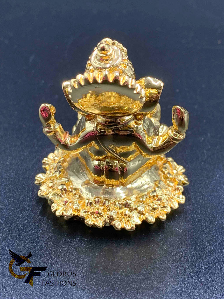 Flower design base with gold Ganesha idol