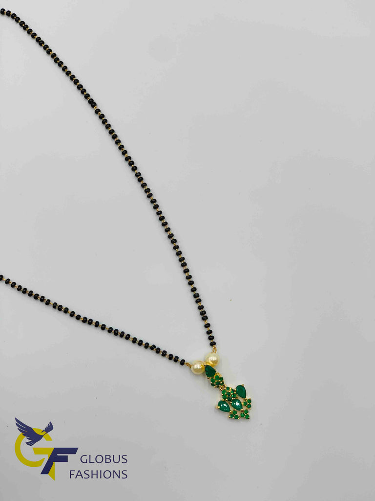 Emerald stones pendant with a single line black beads chain