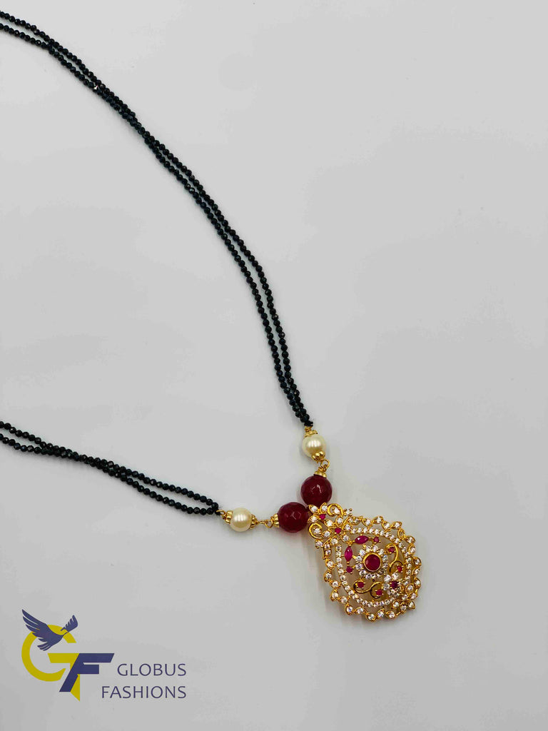 Cz stones and ruby stones pendant with black diamond beads chain