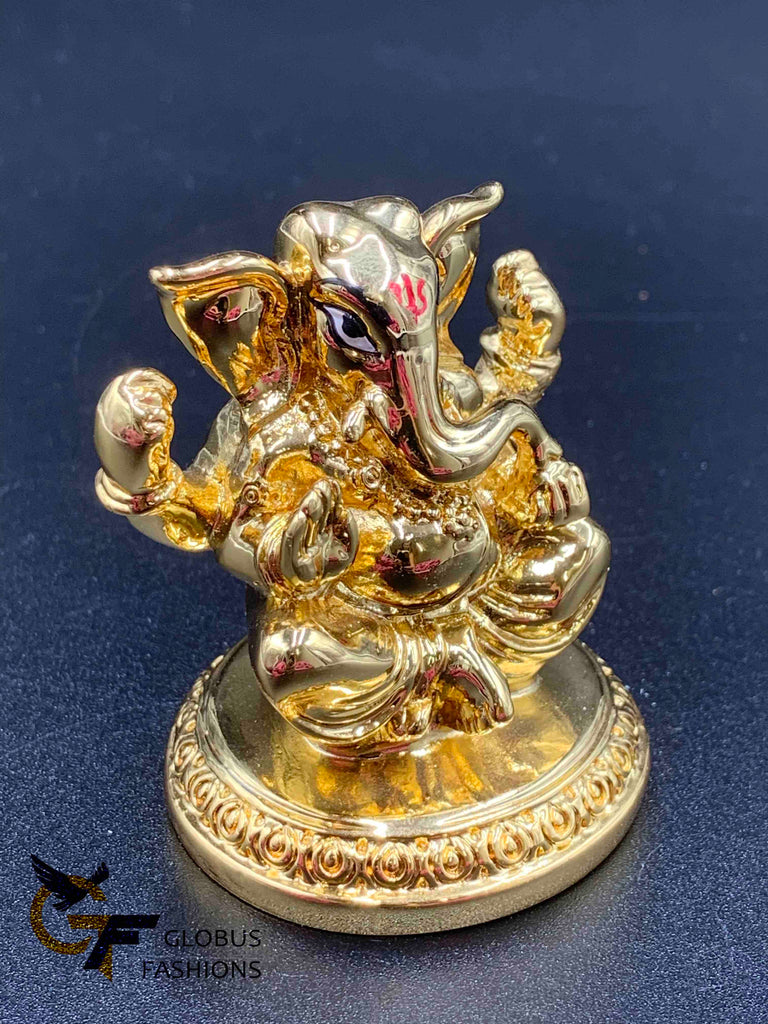 Cute gold ganesh idol