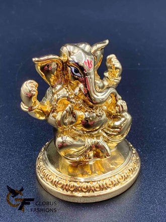 Cute gold ganesh idol