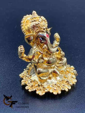 Flower design base with gold Ganesha idol
