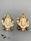 Black and Bluestones with hand-painted enamel car idols