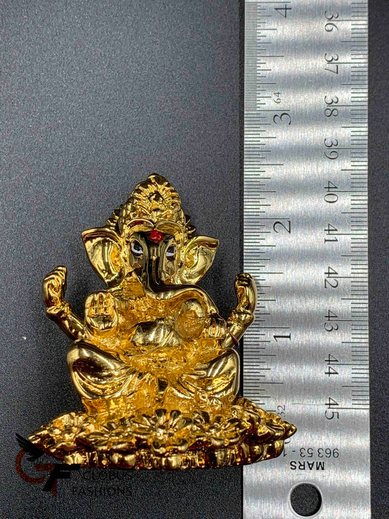 Flower design base with gold Ganesha idol