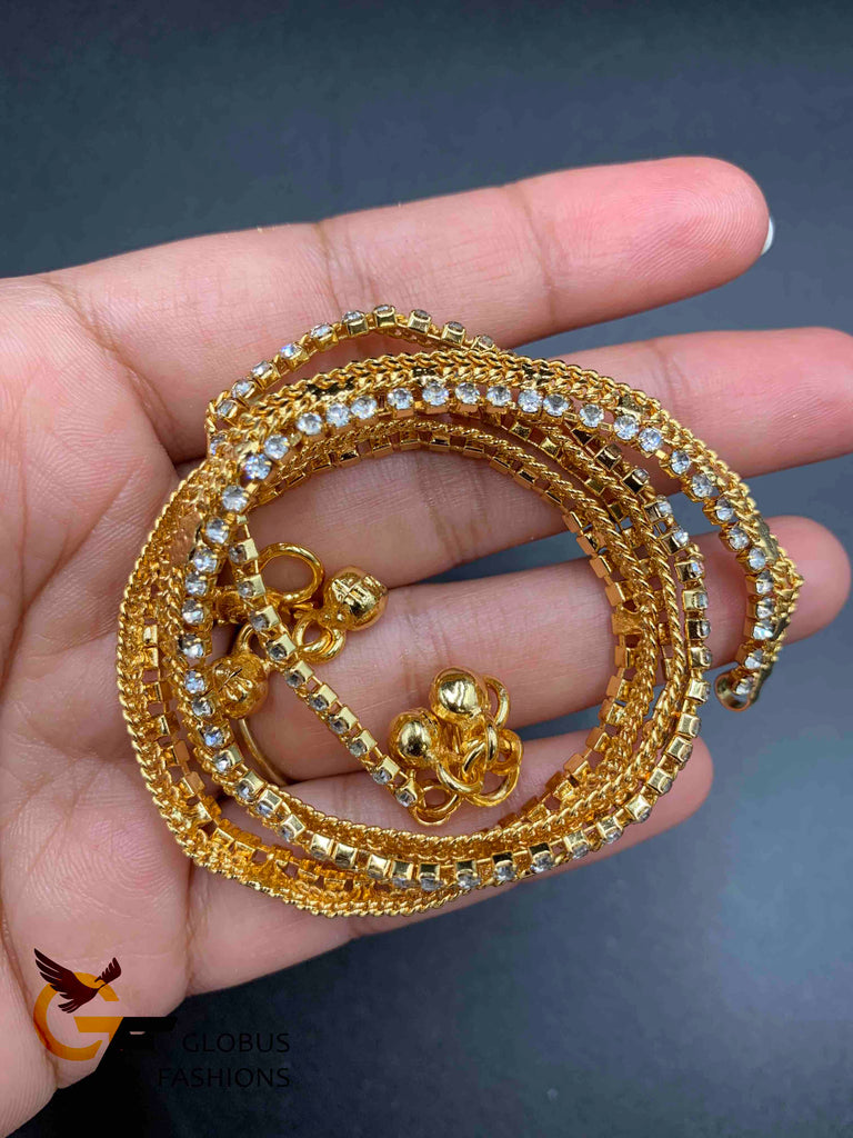 White Stones with gold anklets