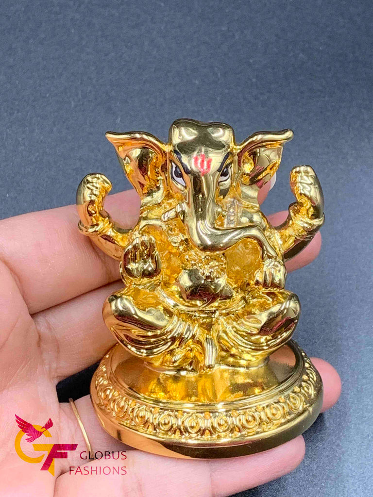 Cute gold ganesh idol