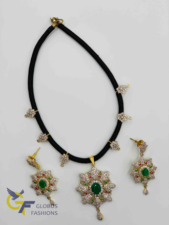 Cz stones and emerald stones pendant and earrings with black thread chain