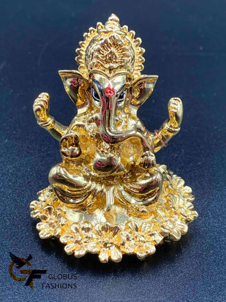 Flower design base with gold Ganesha idol