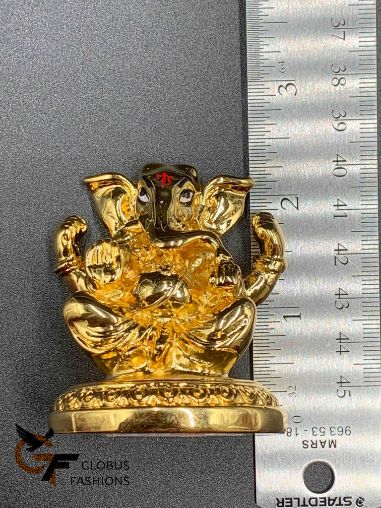 Cute gold ganesh idol