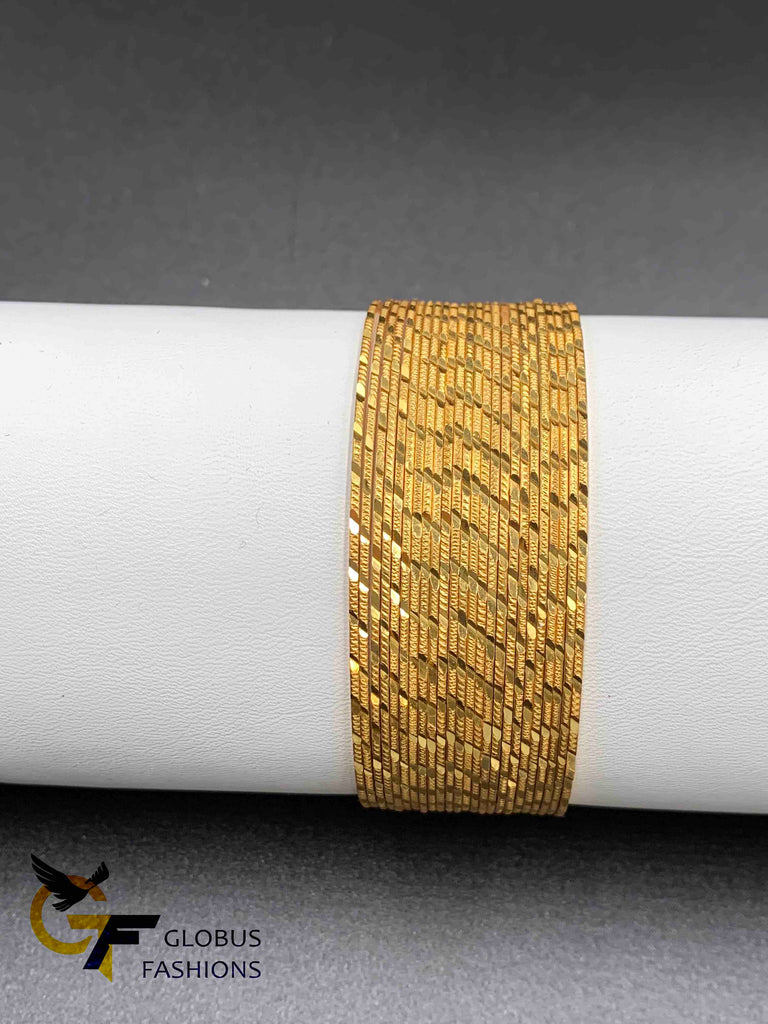 Set of 24 gold self design bangles