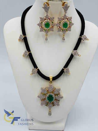 Cz stones and emerald stones pendant and earrings with black thread chain