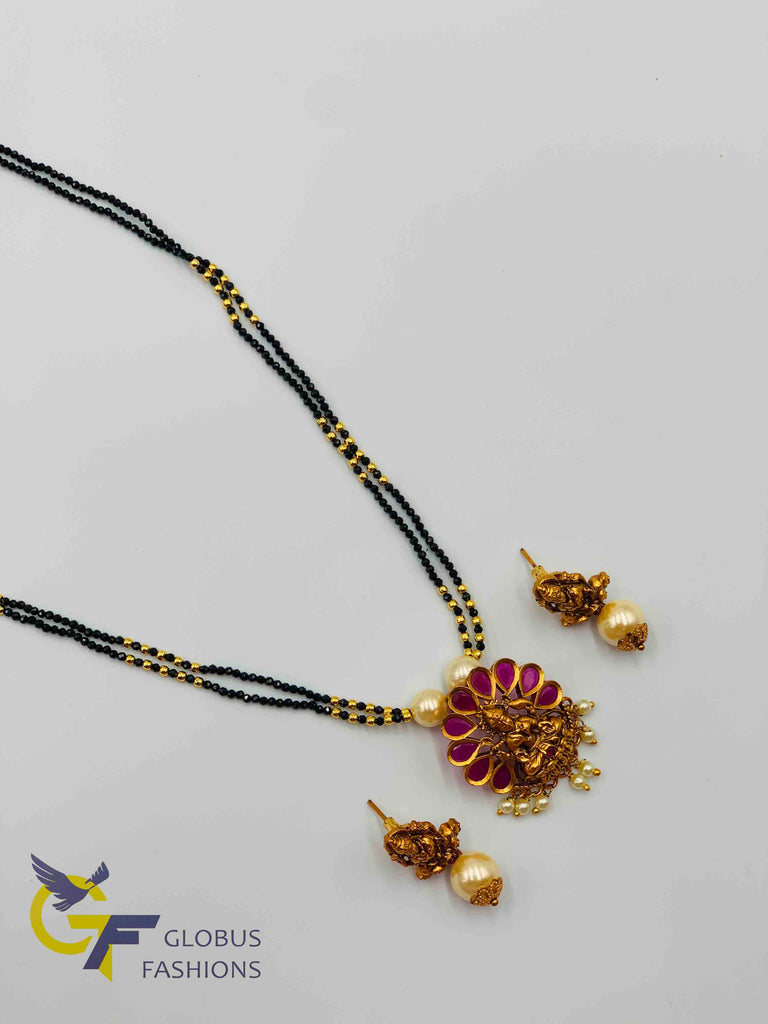 Traditional and antique look Lakshmi print with ruby and pearls pendant set with black diamond beads chain