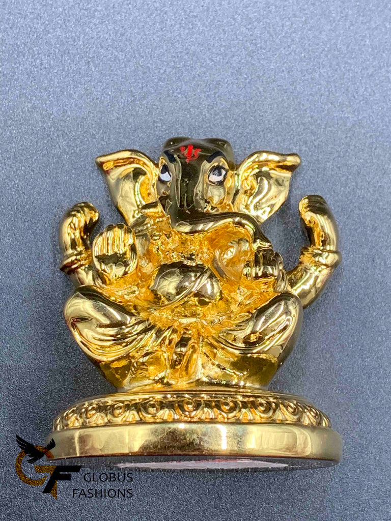 Cute gold ganesh idol