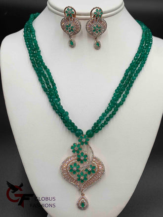 Elegant cz stones and emerald stones pendant set with matching emerald beads chain