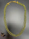 Bunch of green crystal beads twisted with gold chains