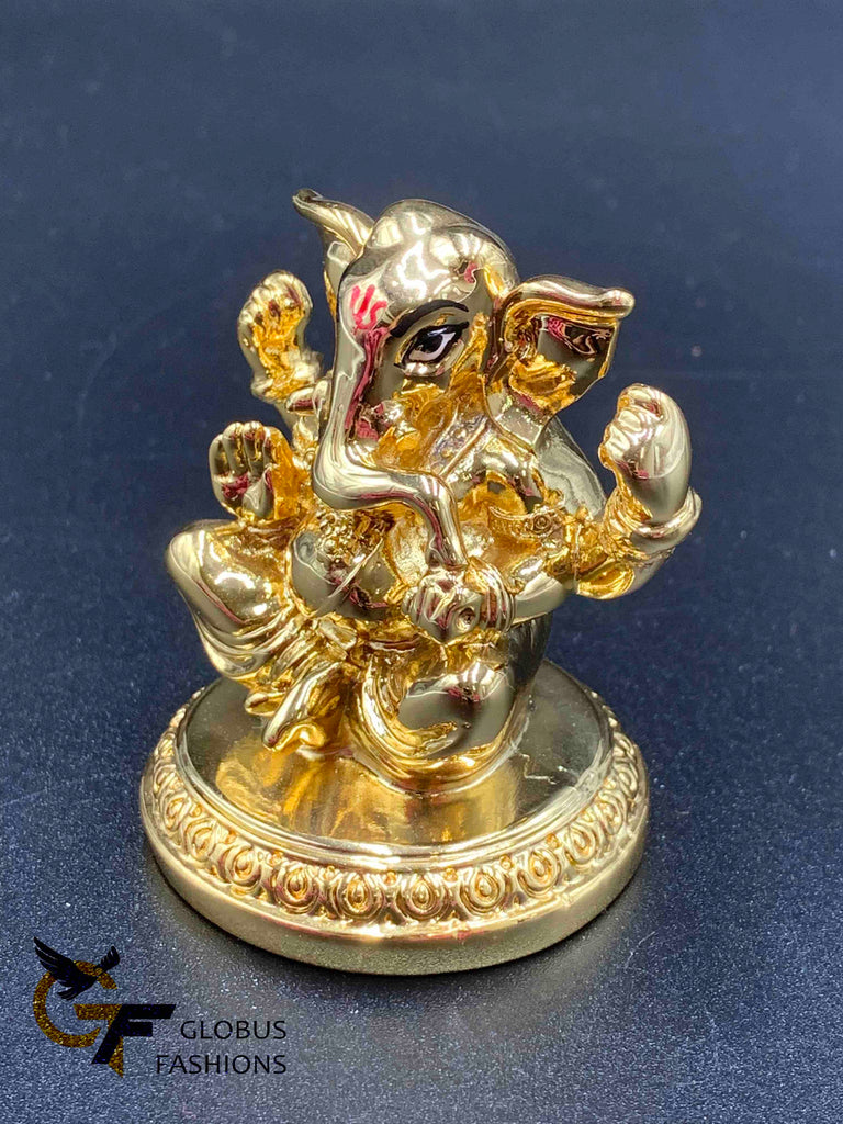 Cute gold ganesh idol