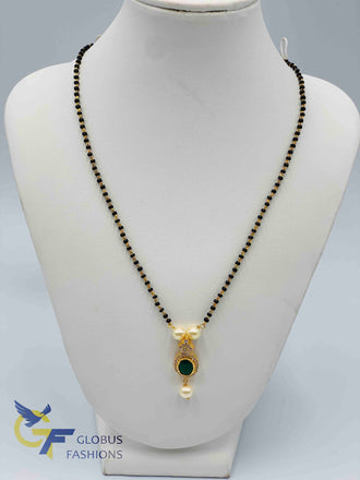 Emerald and cz stones pendant with a single line black beads chain