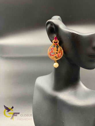 Ruby and CZ stones Peacock design chandbali earrings