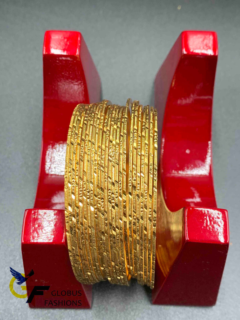 Set of 24 gold self-designed gold bangles