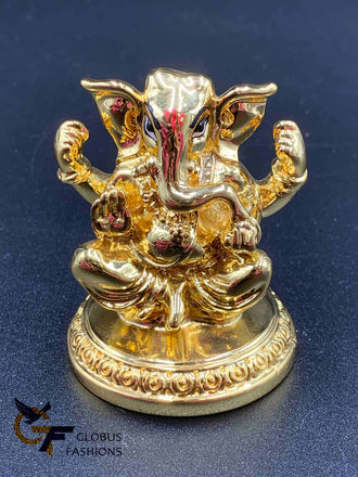 Cute gold ganesh idol