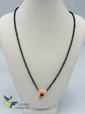 Small cz and ruby stones pendant with a single line black beads chain